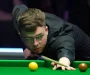 Dean Young defies amateur status to advance