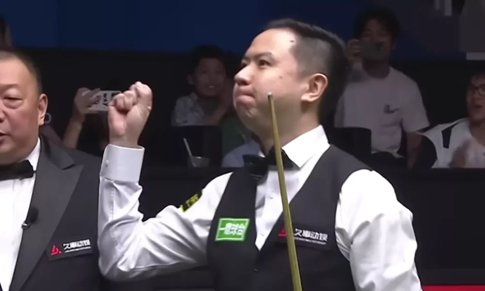 Xiao Guodong celebrates after making a 147 break