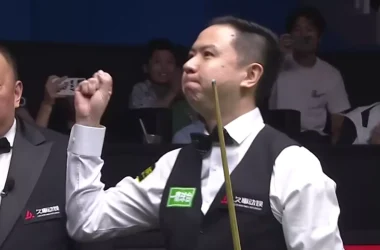 Xiao Guodong celebrates after making a 147 break
