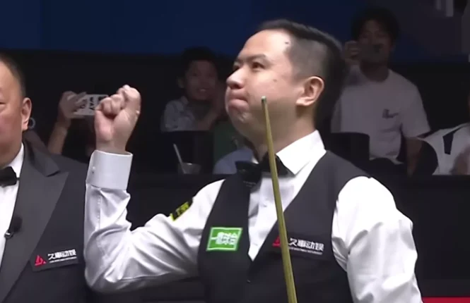 Xiao Guodong celebrates after making a 147 break